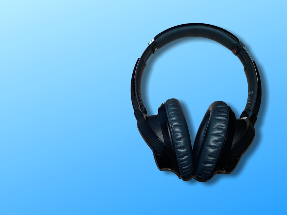black corded headphones on blue background photo – Free Headphones Image on  Unsplash