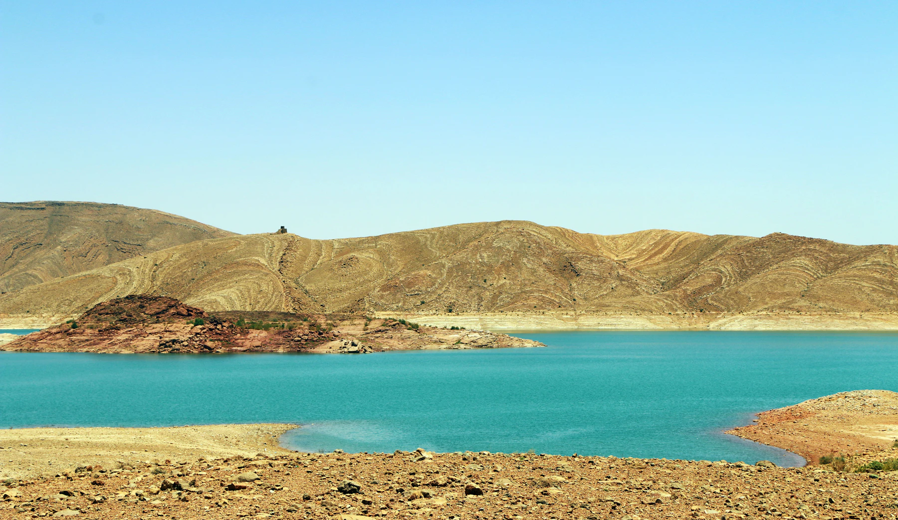 Turquoise lake surrounded by hills near Marrakech