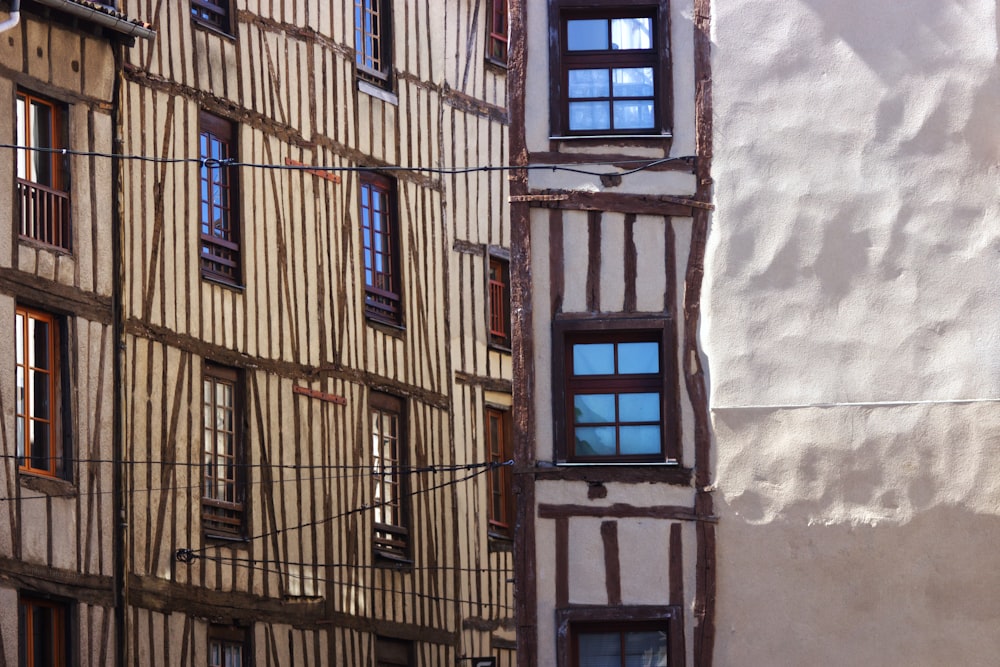 brown concrete building with blue window