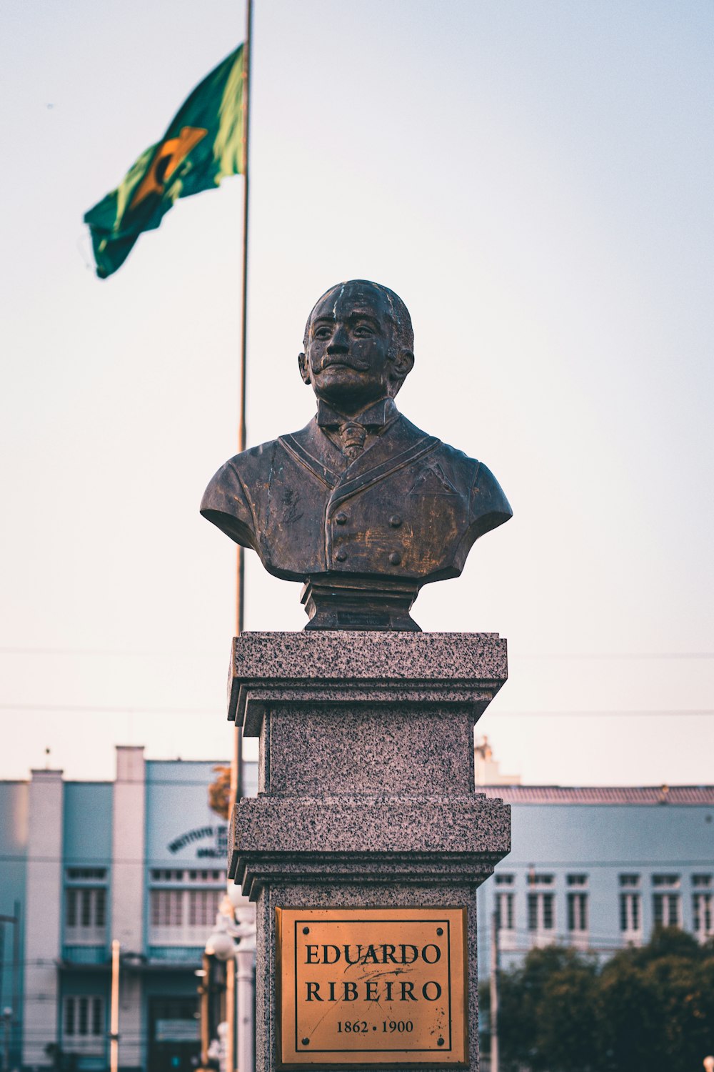 man in black hat statue