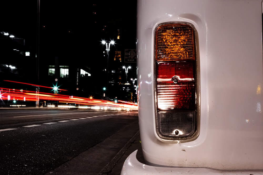 white car on road during night time