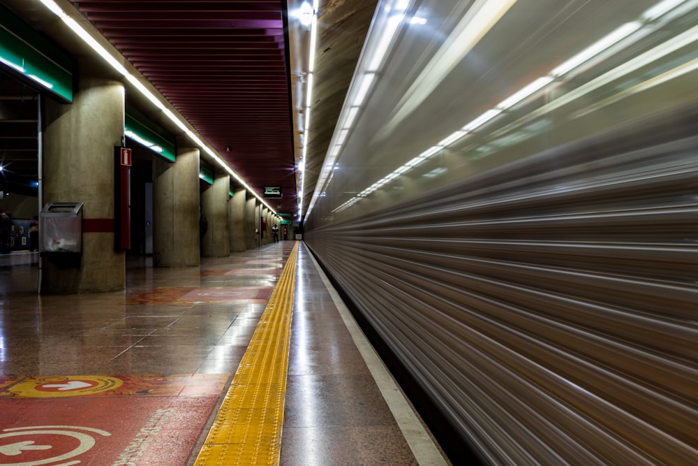 brown and white tunnel with lights