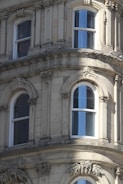 Before and after images of a restored facade highlighting the transformation.