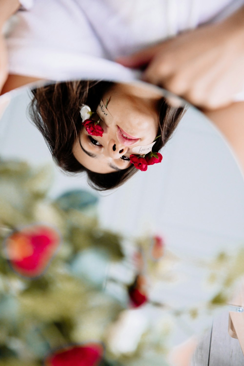 girl in white and red dress with red ribbon on her head