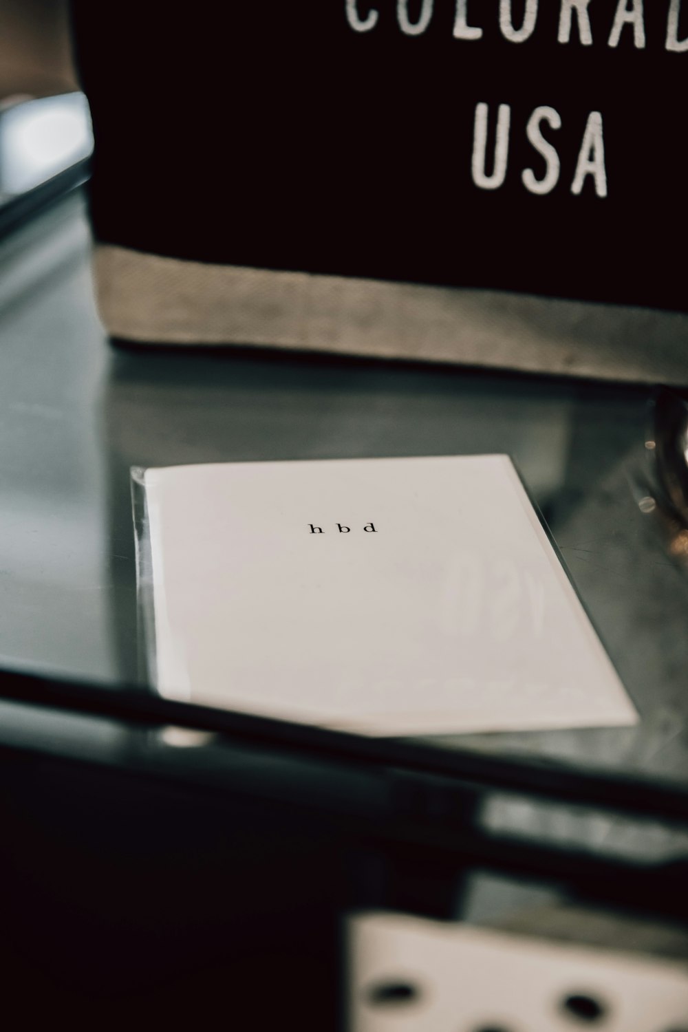 white box on brown wooden table