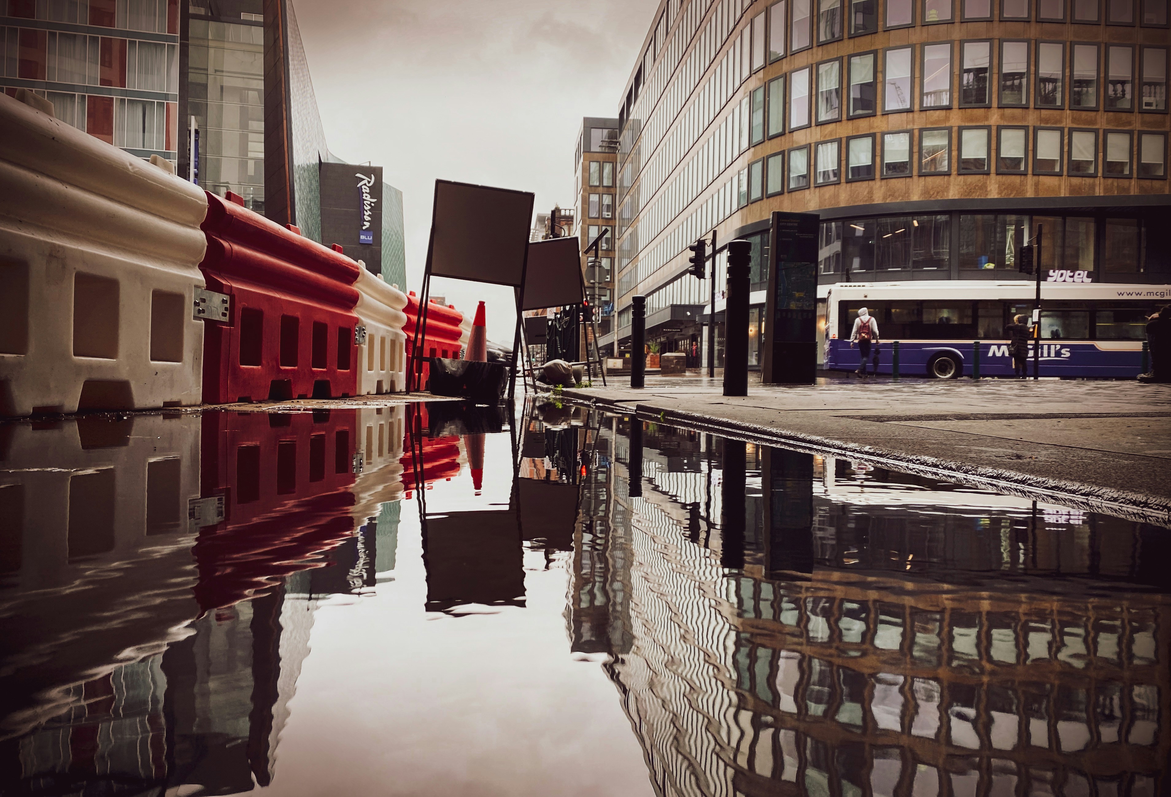 brown and white concrete building near body of water during daytime