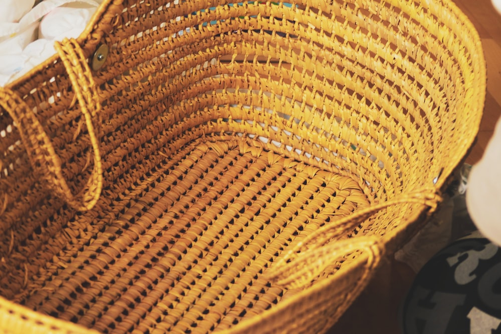 brown woven basket on black textile