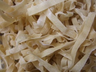 white pasta on brown wooden table