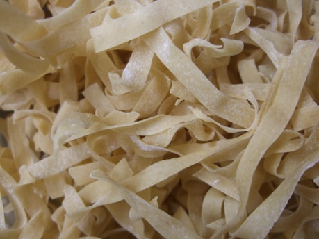 white pasta on brown wooden table