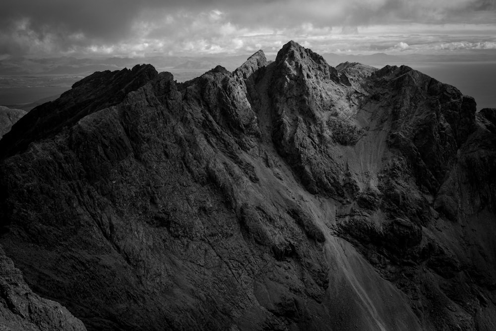 grayscale photo of rocky mountain