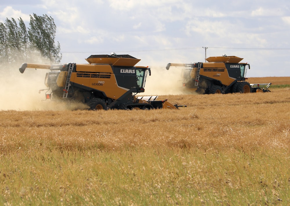 red and black tractor on brown grass field during daytime