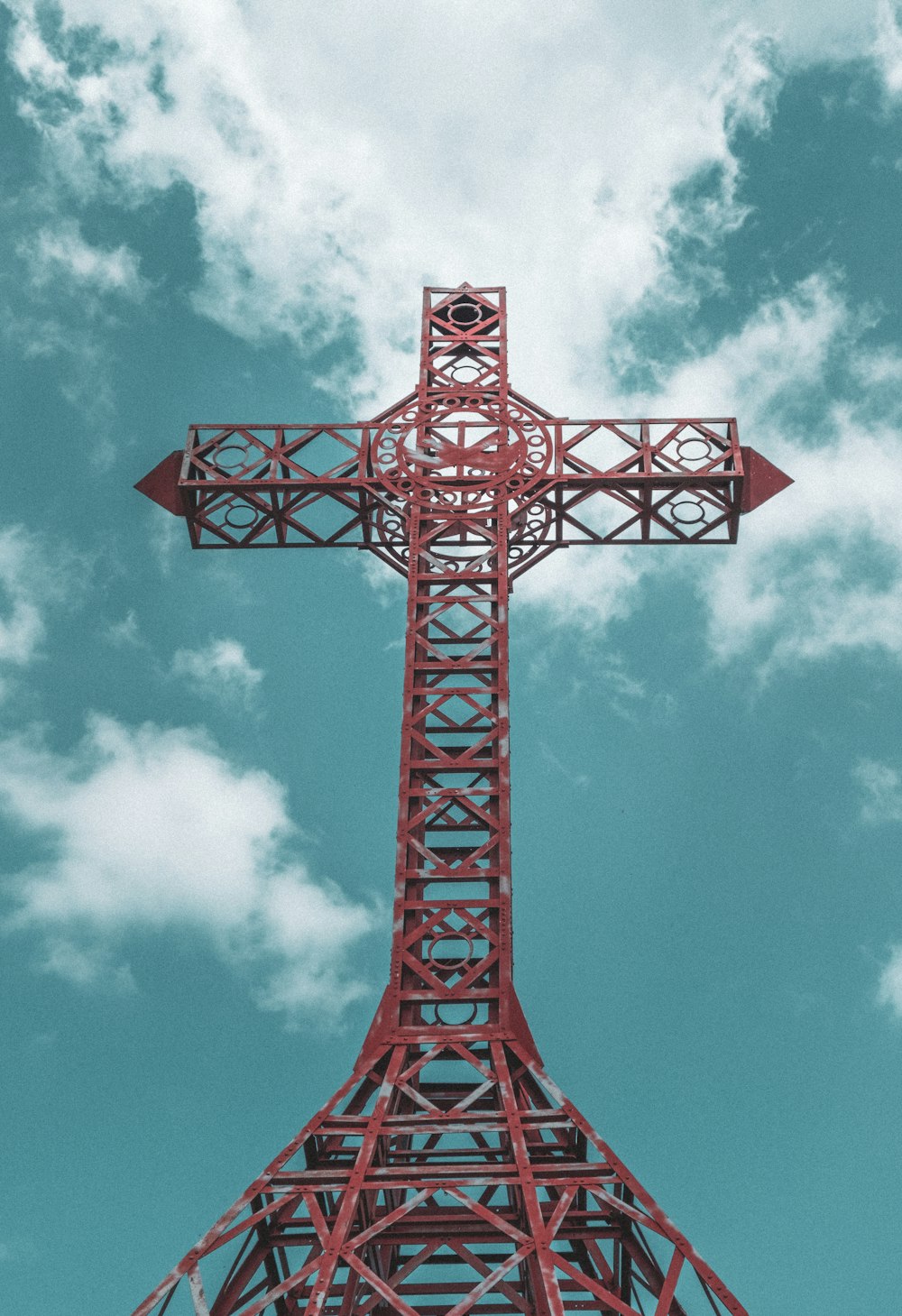 red metal tower under blue sky