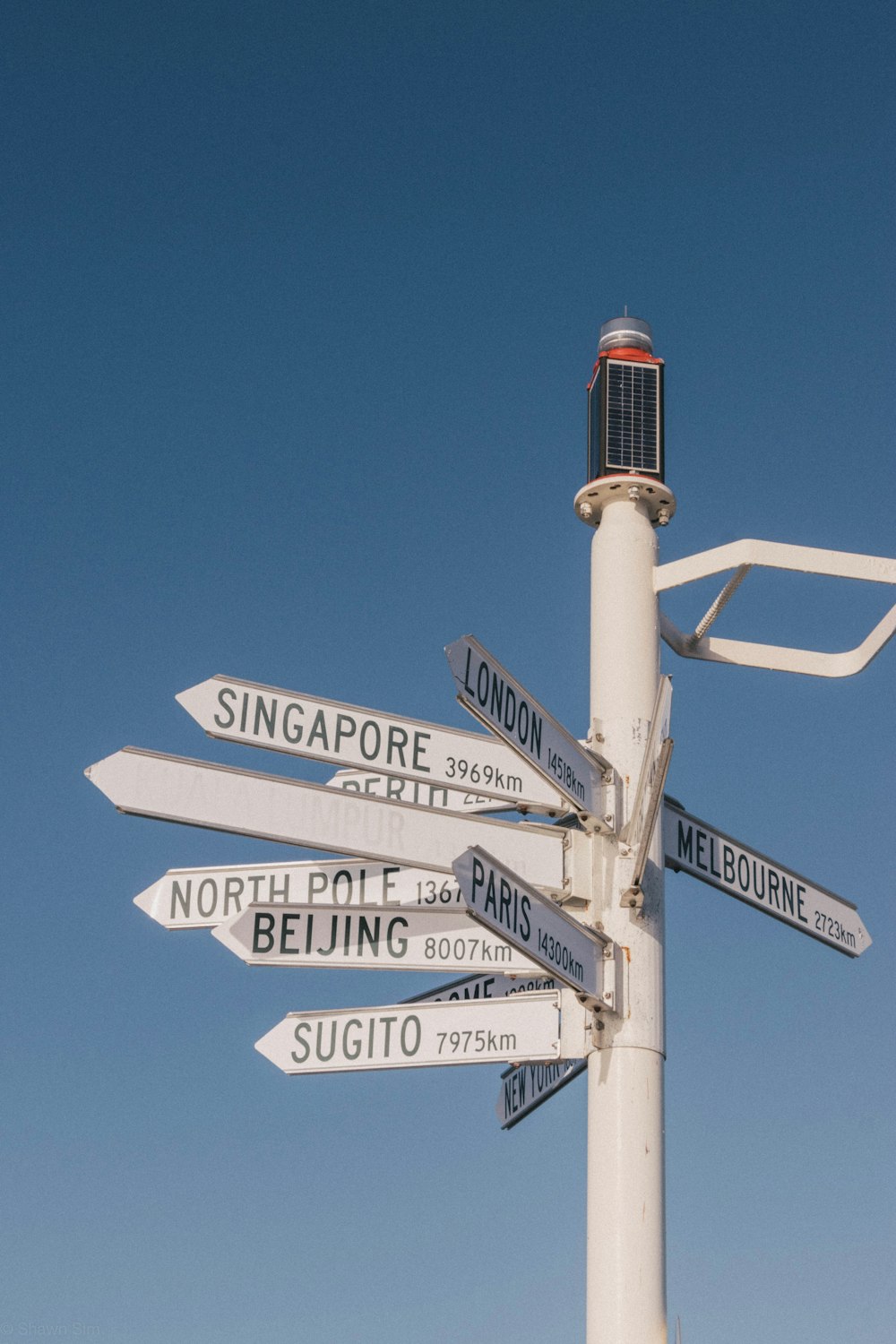 white and black street sign