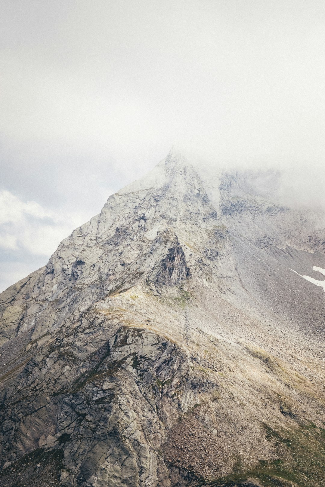 gray and white mountain under white clouds during daytime