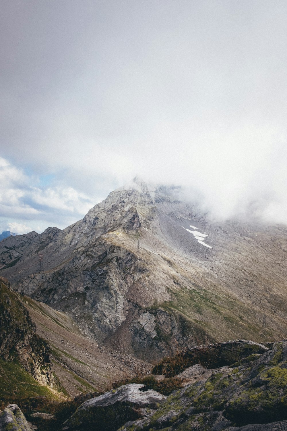 gray and brown mountain under white clouds during daytime