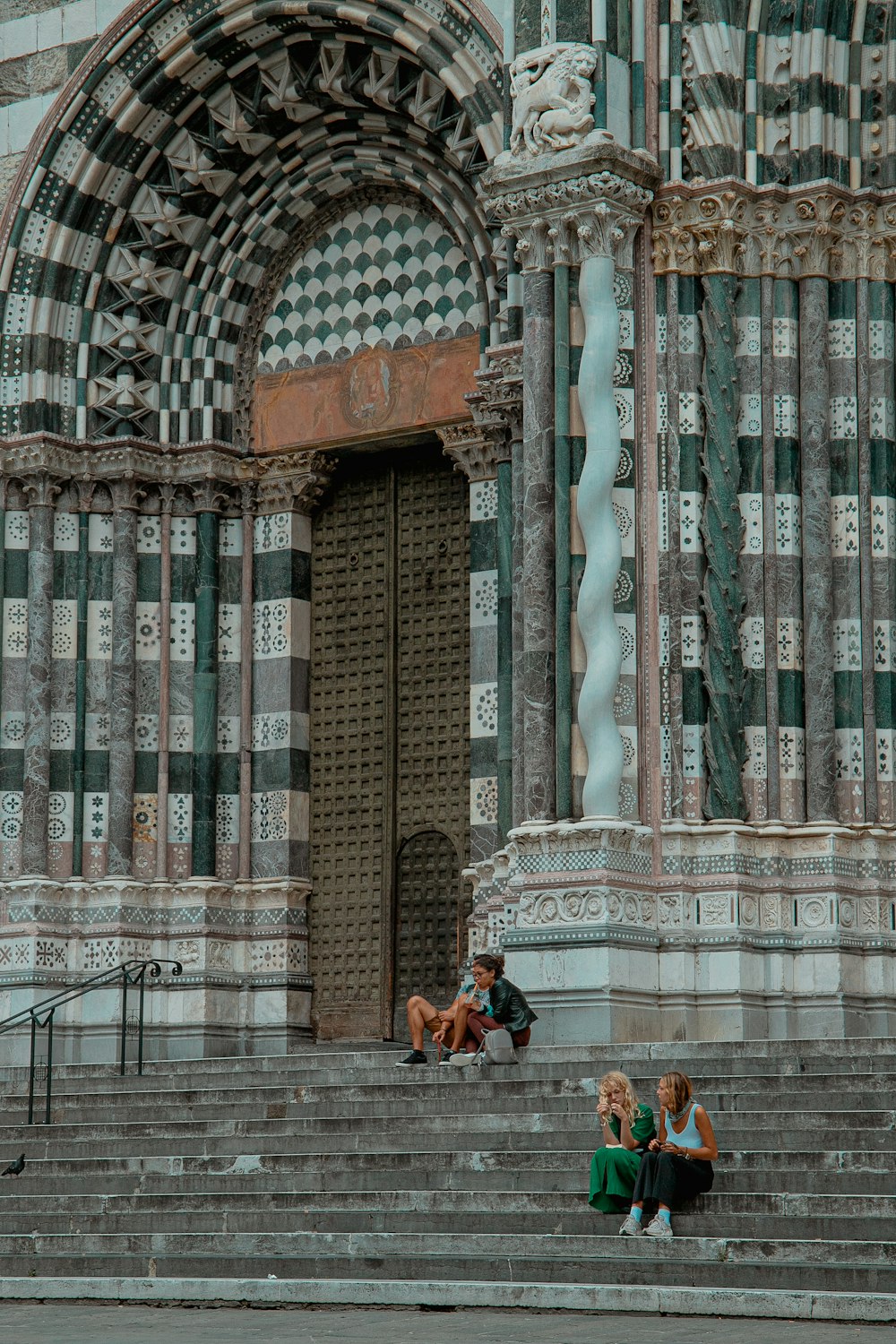 2 women sitting on bench