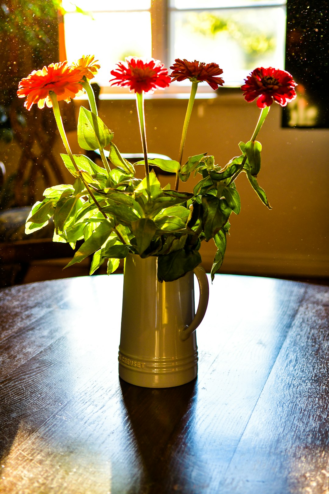 red and yellow flowers in vase