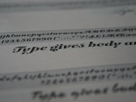 A set of modern font samples displayed on textured paper with elegant typography.