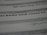 An image featuring a close-up view of text on a paper. The text includes various font styles and sizes, focusing on a bold and larger typeface in the middle. The image is blurred in certain areas, creating a depth of field effect.