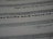 An image featuring a close-up view of text on a paper. The text includes various font styles and sizes, focusing on a bold and larger typeface in the middle. The image is blurred in certain areas, creating a depth of field effect.