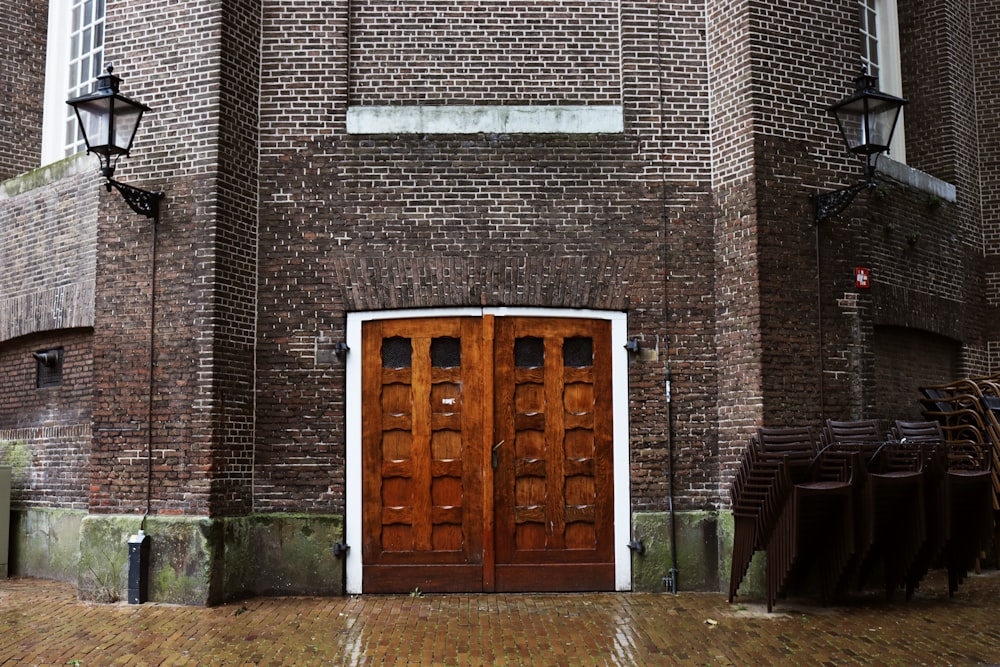 brown wooden door on brown brick building