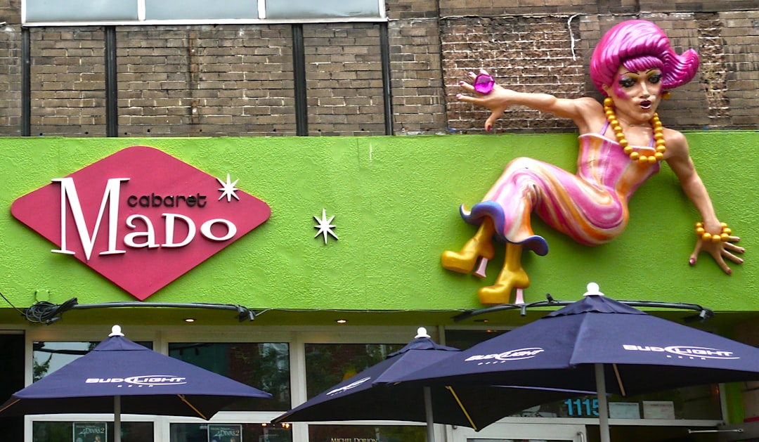 woman in pink dress sitting on green bench, Chez Mado<p></figure>Bar emblématique du Village gai de Montréal, ce cabaret saura vous divertir par ses spectacles de drag-queens hauts en couleur! La célèbre Mado Lamotte vous invite à passer des moments cocasses où le rire est garanti!</p><p>Mado Lamotte est une drag queen, chroniqueuse et chanteuse montréalaise interprétée par Luc Provost depuis juillet 1987.