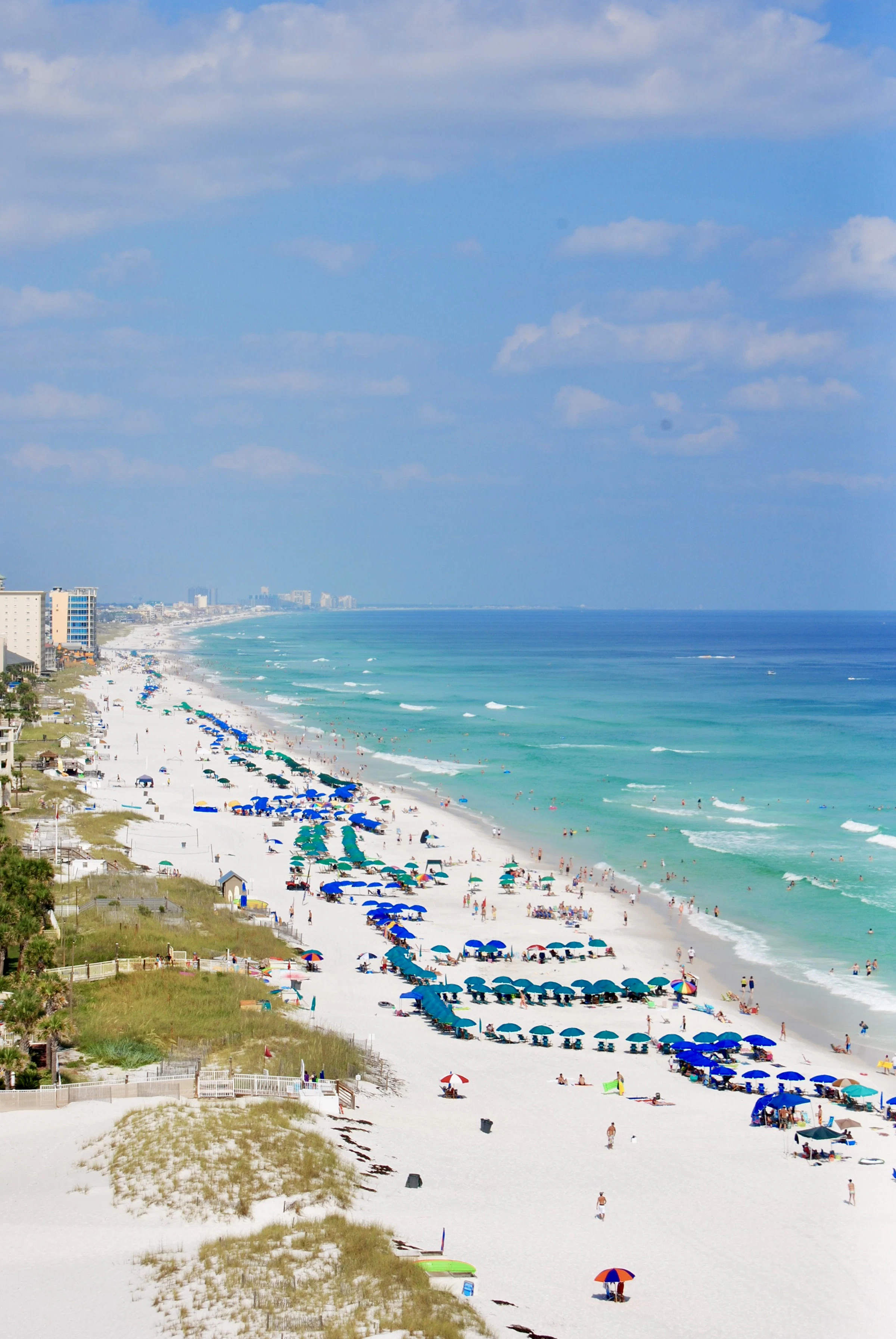 Clear Gulf water over pale sand on a calm afternoon