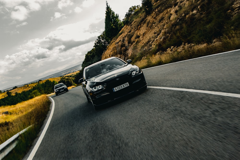 black mercedes benz c class on road during daytime