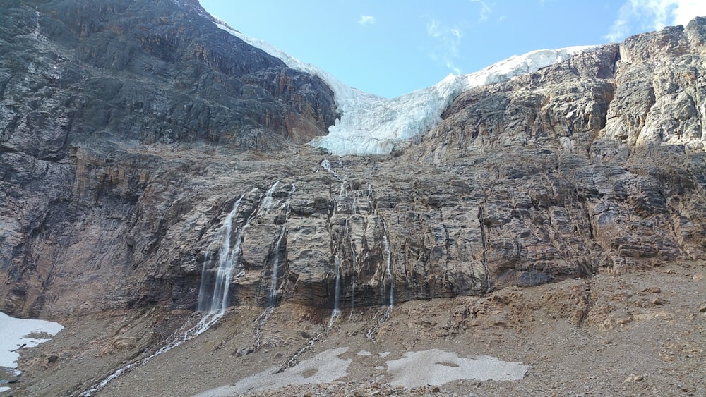 brown rocky mountain under blue sky during daytime