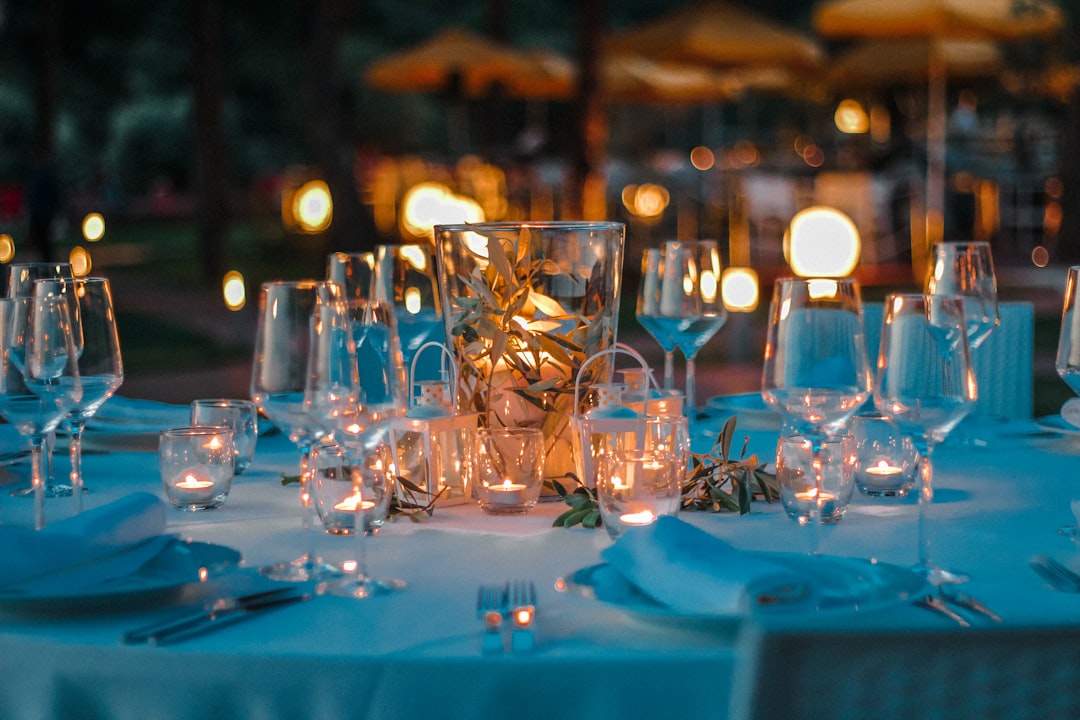 clear wine glasses on blue table cloth