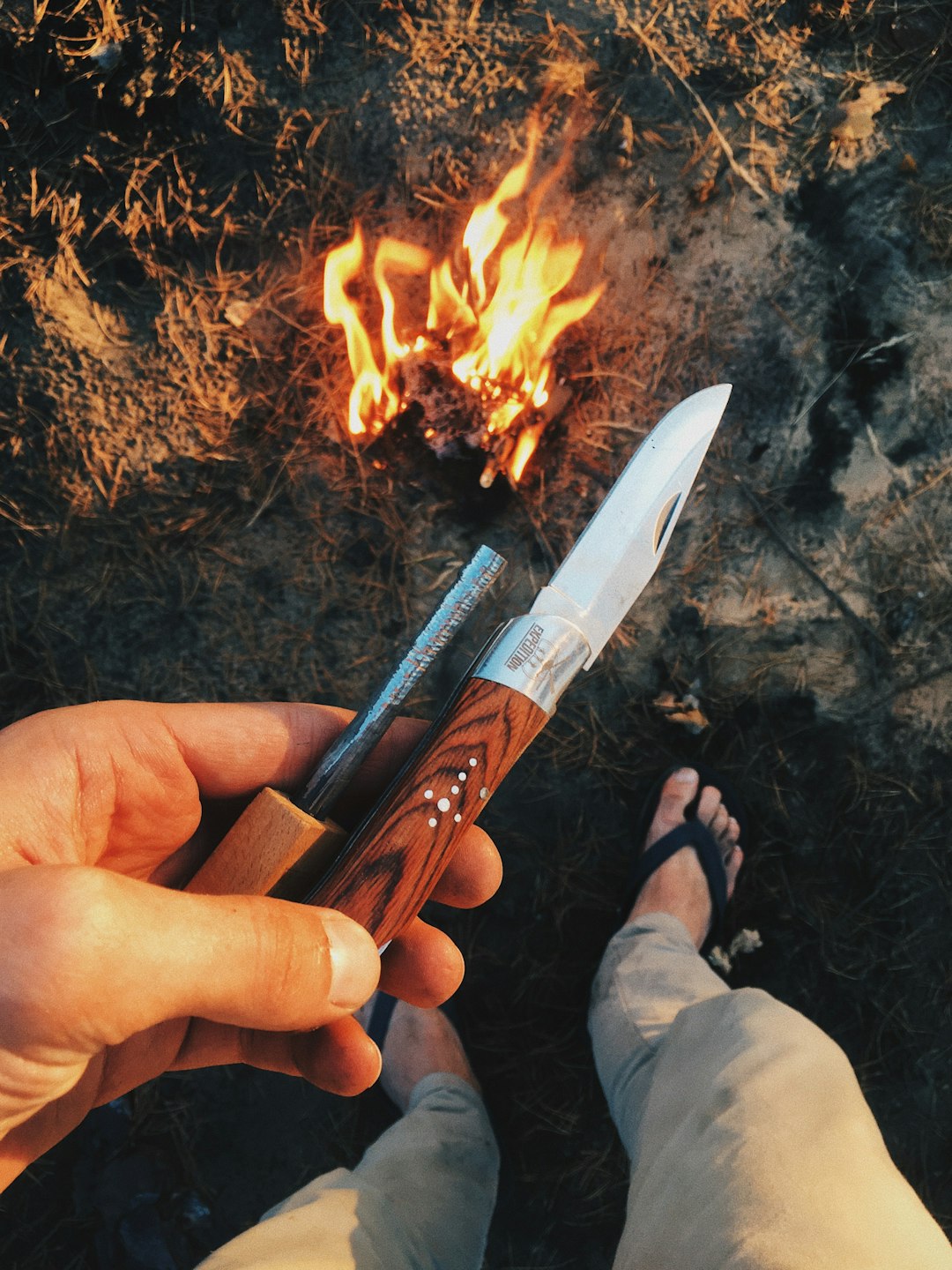 person holding brown and silver knife