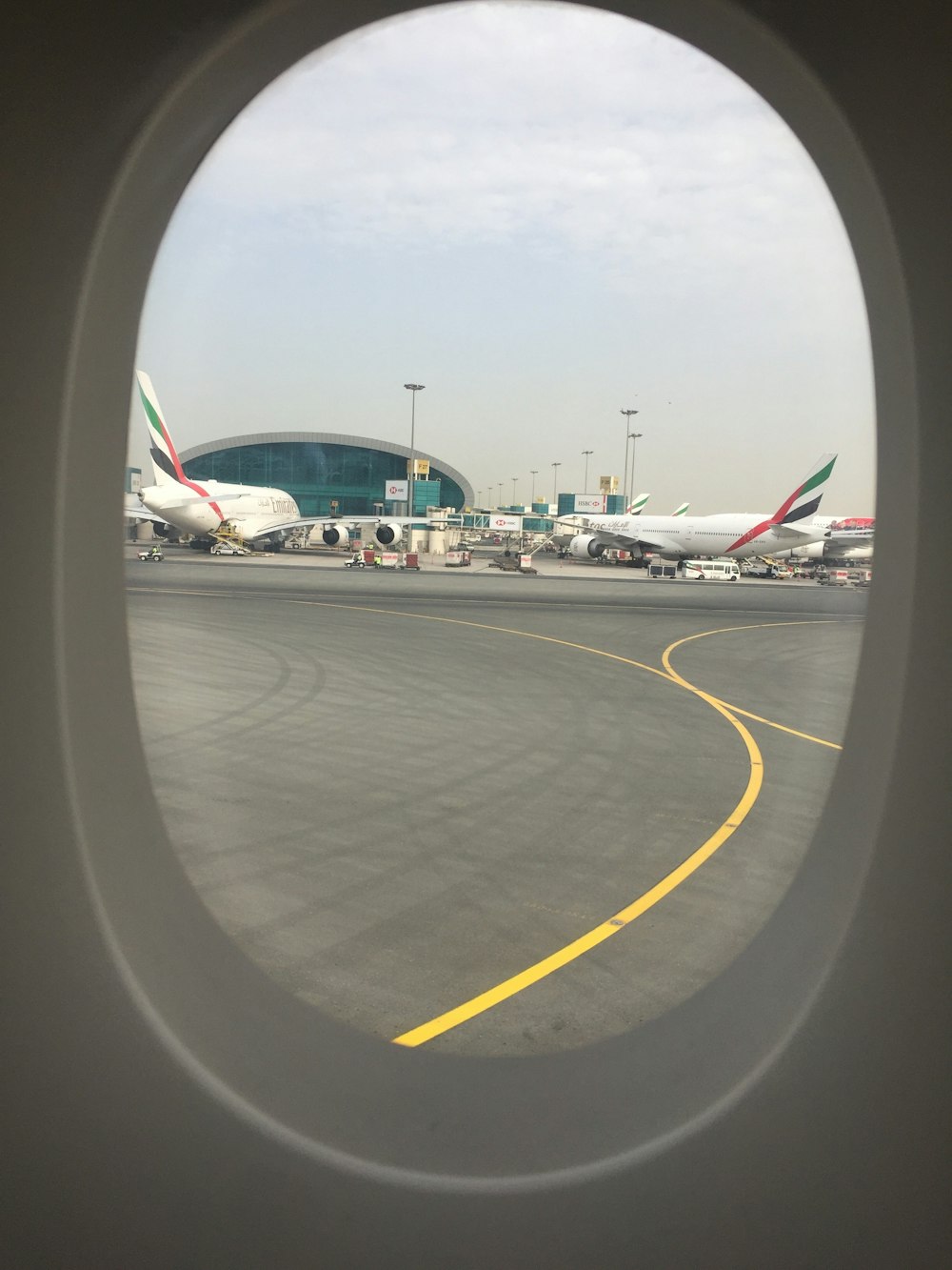 white and red airplane on airport during daytime