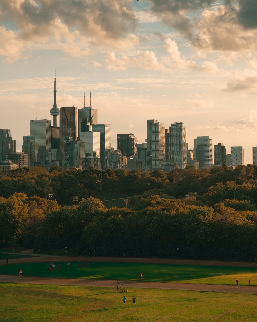 city skyline under cloudy sky during daytime