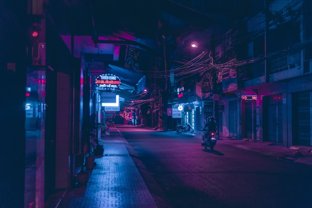 people walking on street during night time