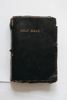 black leather case on white table