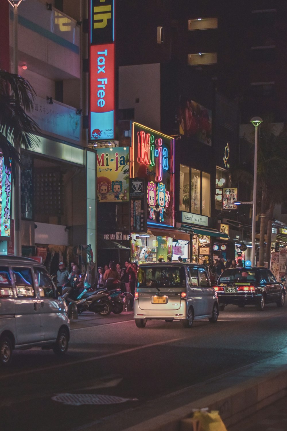 cars parked on street during night time