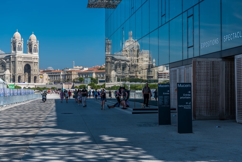 people walking on street near buildings during daytime