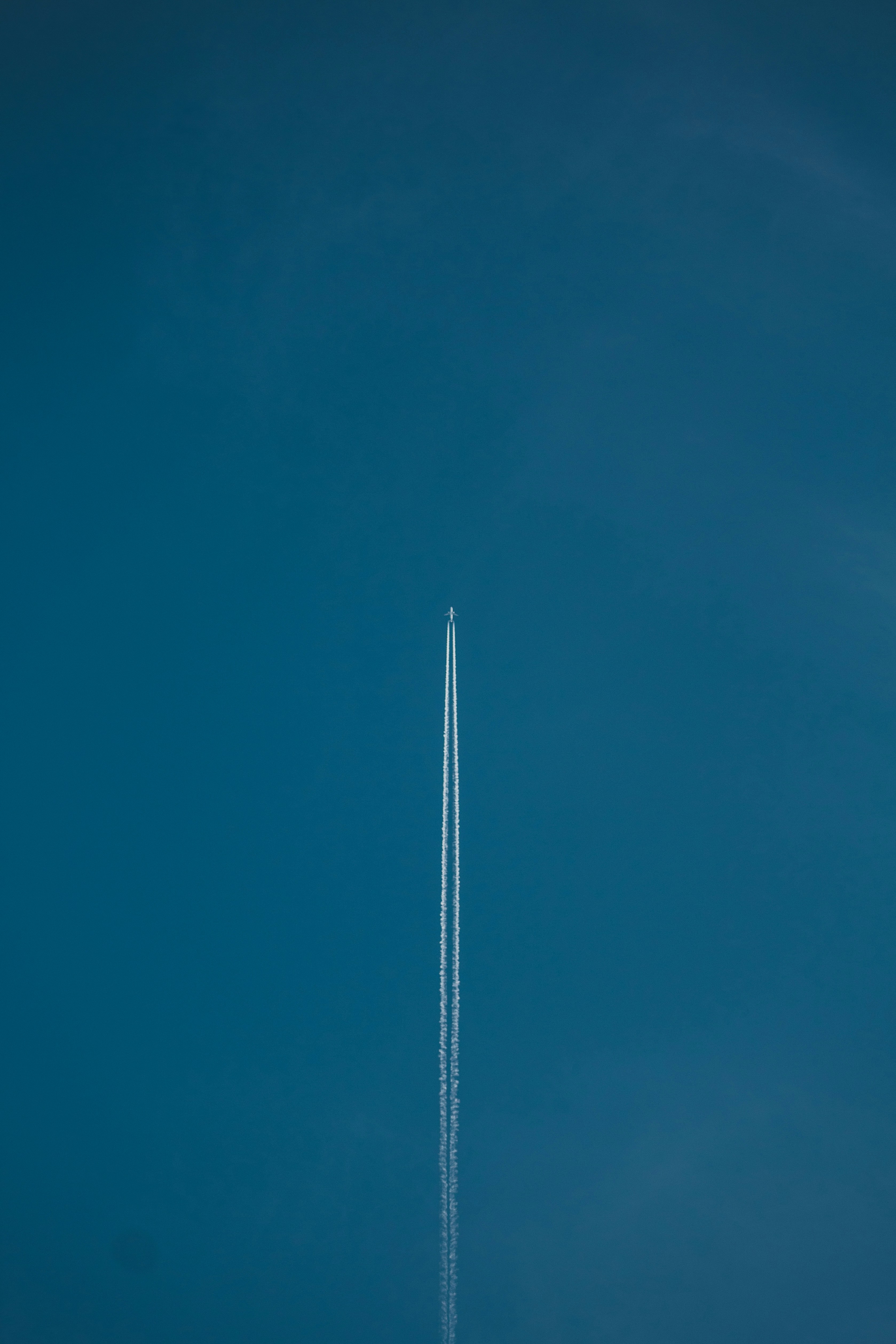 white light post under blue sky