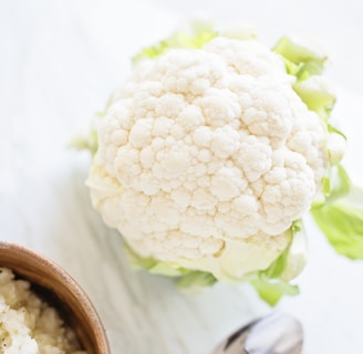 white flower on brown wooden round pot