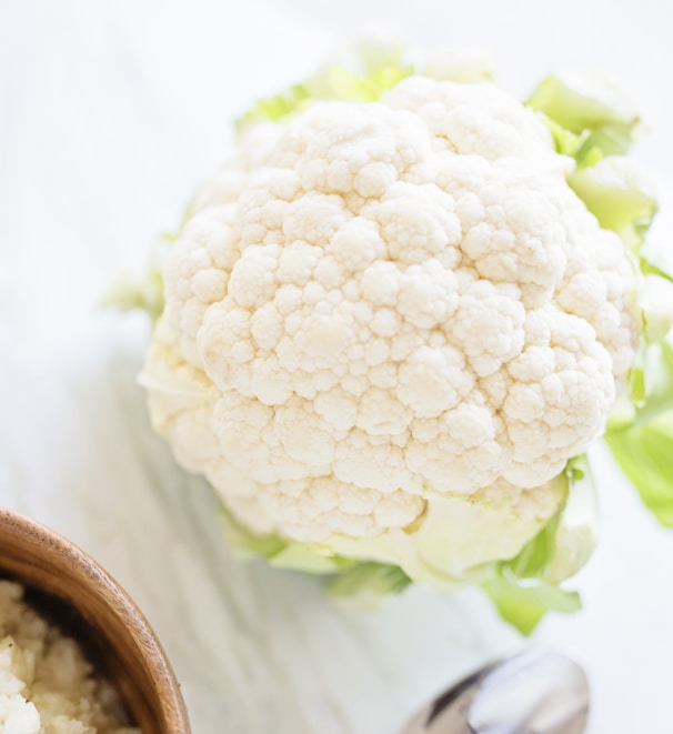 white flower on brown wooden round pot