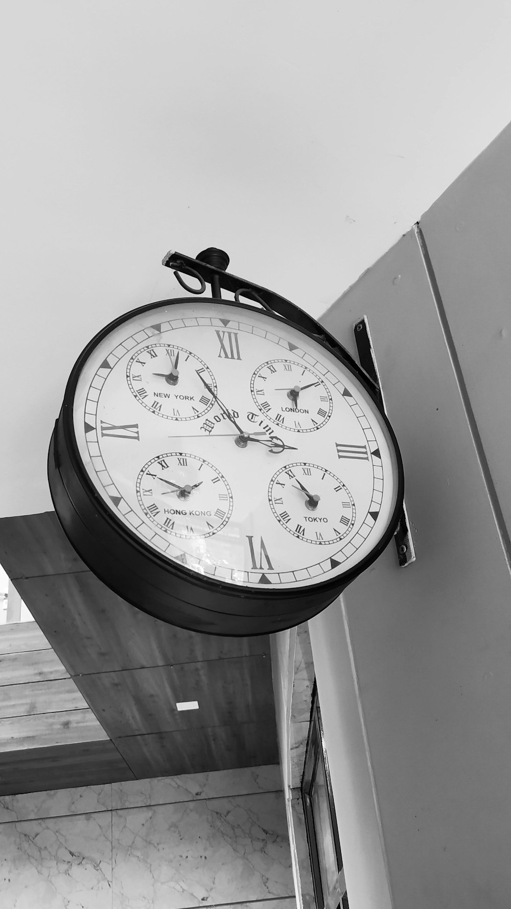 black and white round analog wall clock
