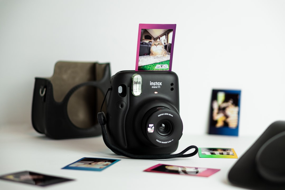 black nikon dslr camera on white table