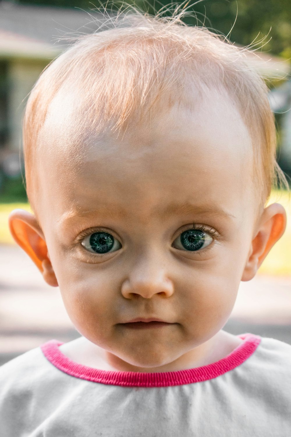 baby in white and red shirt