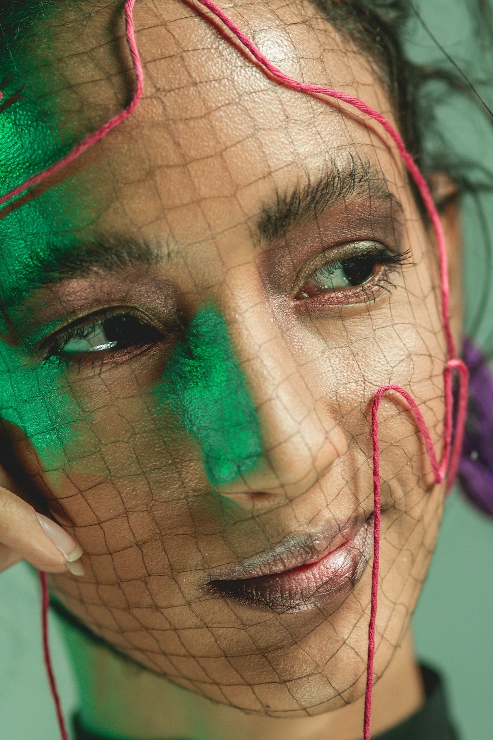 woman with green and red face paint