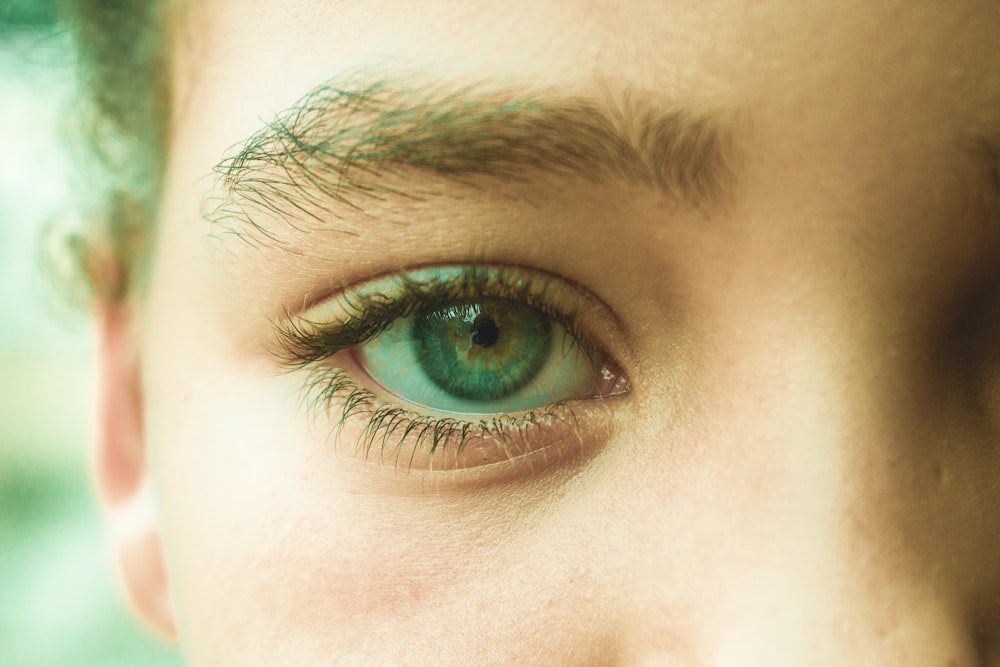 persons eye in close up photography