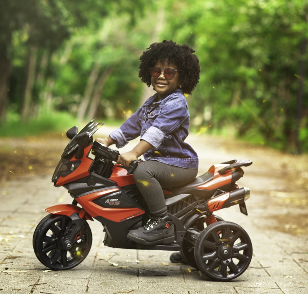 man in blue dress shirt and black pants riding red motorcycle