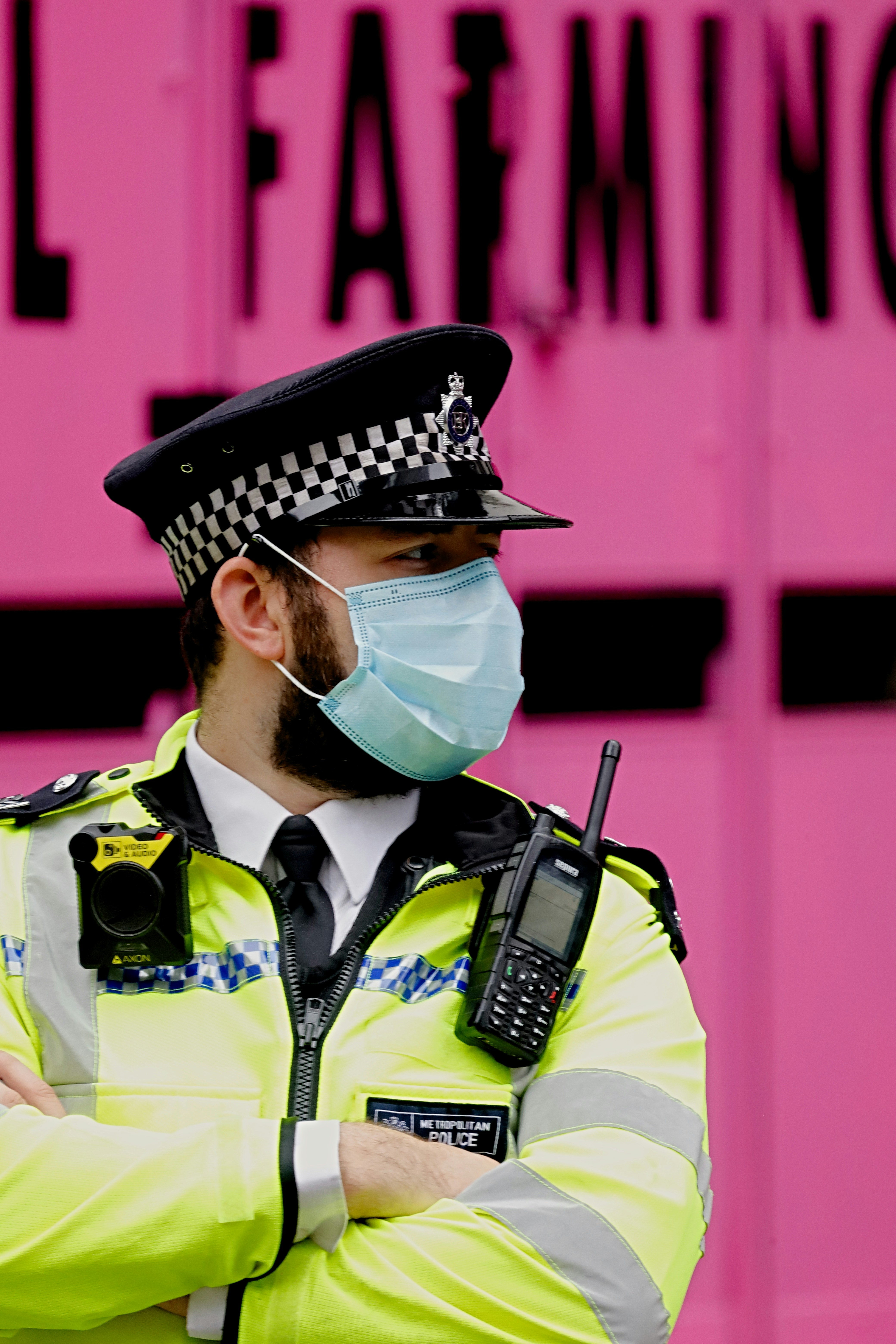 man in yellow button up shirt wearing black sunglasses and black hat