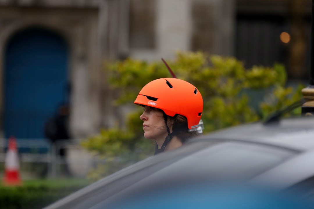 woman in red helmet in car