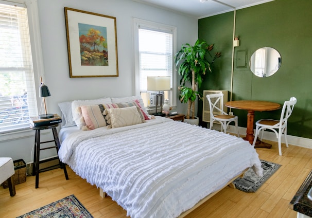 white bed linen on bed