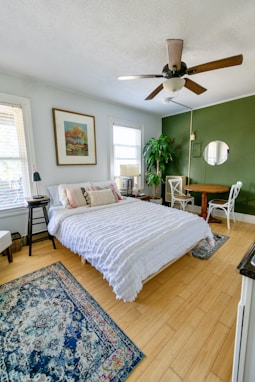 white bed linen on bed